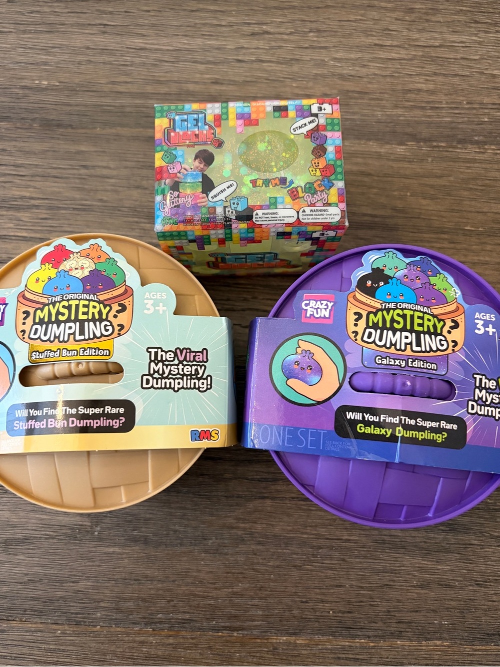 2 opened Dumplings- Stuffed Bun & Galaxy Editions + unopened Gel Block Squishy.